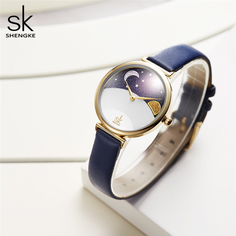 Reloj Shengke de moda azul para mujer, reloj de cuarzo de cuero para mujer, reloj de pulsera informal resistente al agua, esfera romántica con luna y estrellas