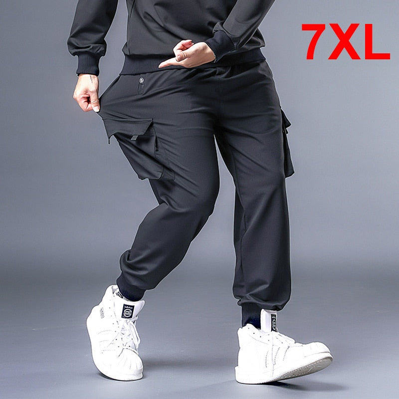 Pantalones holgados para hombre, ropa informal estilo Hip Hop, pantalones Cargo de talla grande 7XL, pantalones de chándal para hombre, pantalones de moda de gran tamaño para correr, pantalones de talla grande HX530