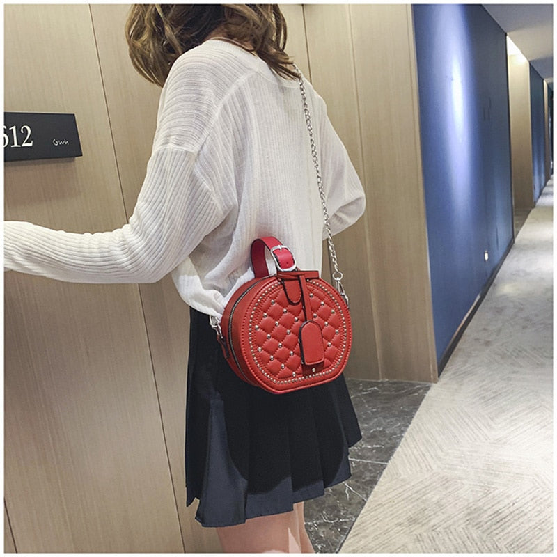 Bolso de hombro Circular con remaches de cadena a la moda para mujer, bandolera cruzada de piel sintética para mujer, bolso de mano redondo para mujer