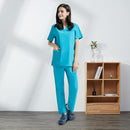 Hospital sala de operaciones negro azul enfermera Scrubs Set salón de belleza trabajo uniforme médico quirúrgico Tops pantalones mascota Doctor ropa de trabajo