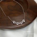 Collar con colgante magnético de trébol de cuatro hojas con corazón de nuevo diseño para mujeres y niñas, joyería de regalo de Navidad de acero de titanio y circón a la moda